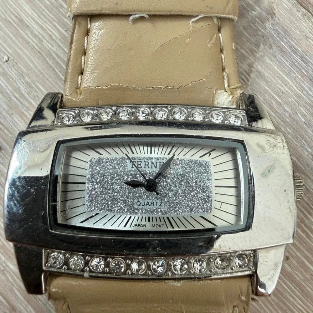 Tan leather watch with silver accents